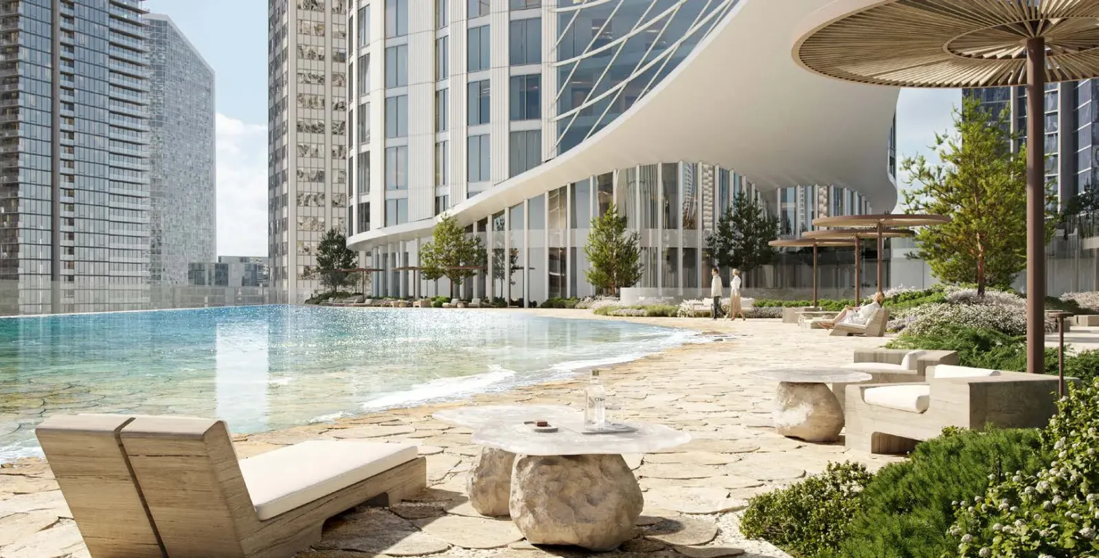 Зона отдыха у бассейна в парке AURUS Residences