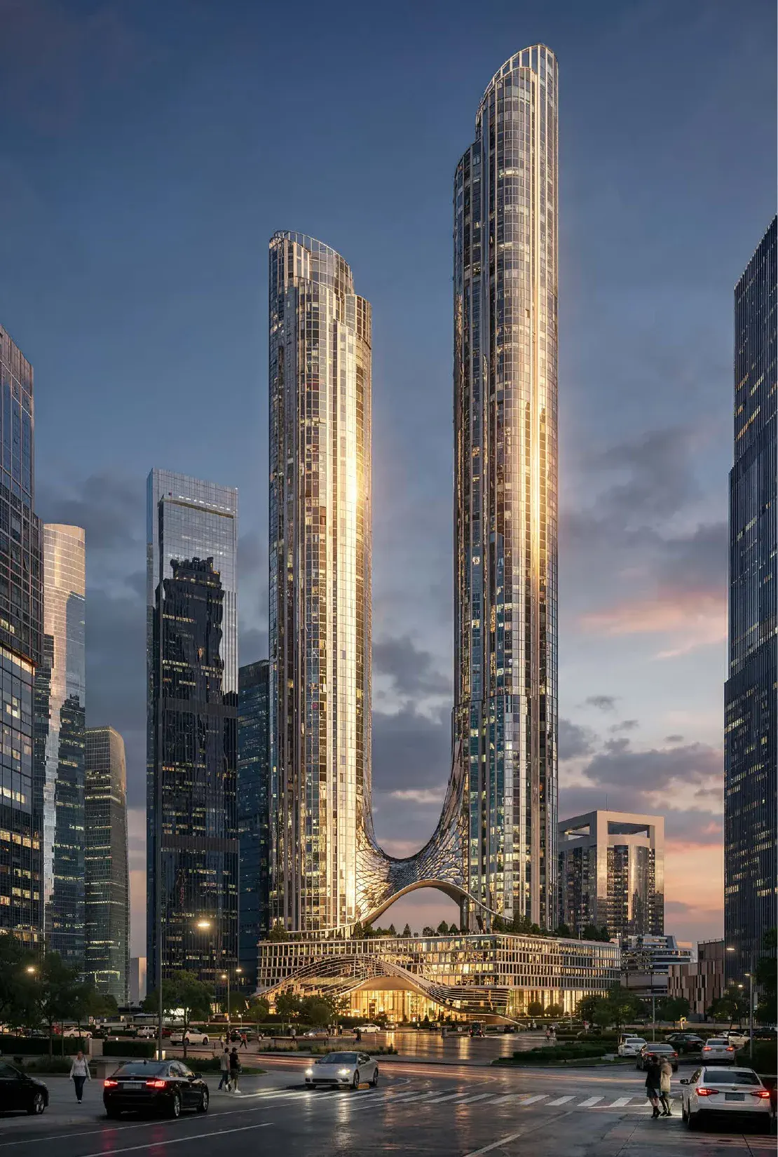 Башни AURUS Residences с улицы на закате: обе башни и арка перехода